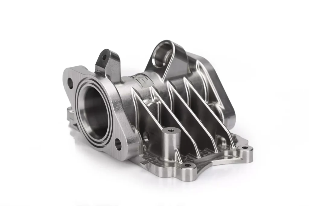 Machined metal automotive part on display.