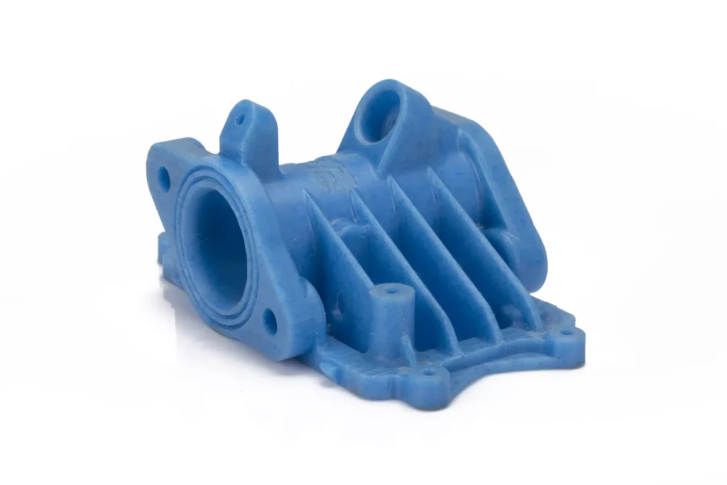 Blue plastic industrial part with multiple holes