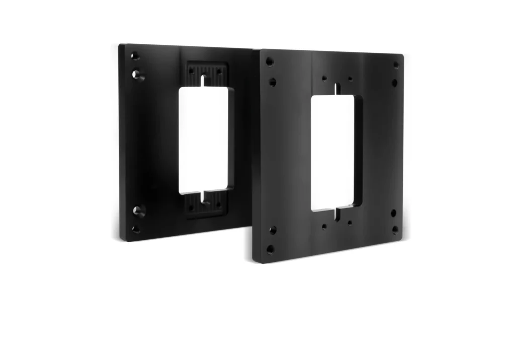 Two black wall mount brackets with cutouts.