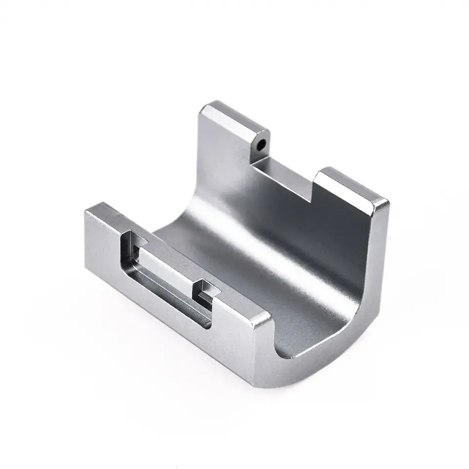 Gray metal bracket for machinery parts.