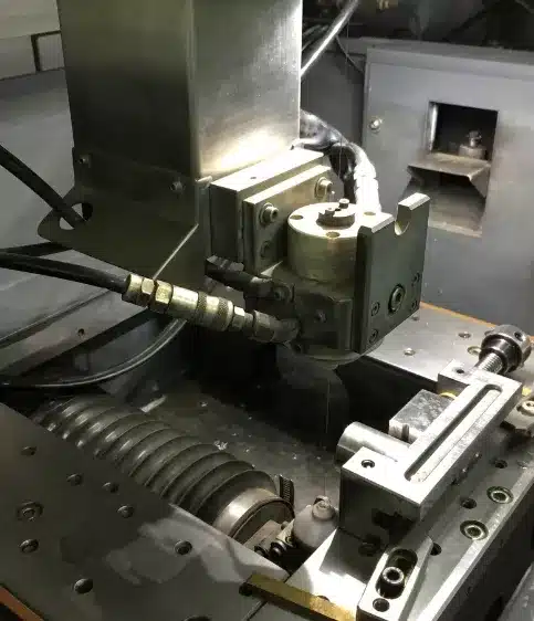 Metal CNC machine in operation, close-up view.