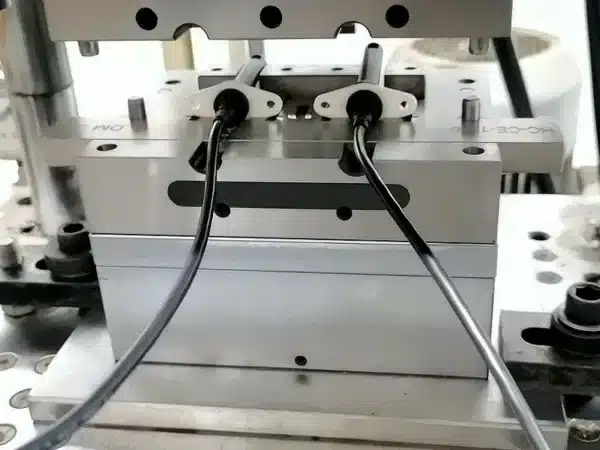 Industrial machine with metal rods and wires connected.