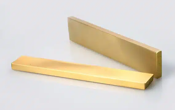 Gold rectangular metal bars on white background.