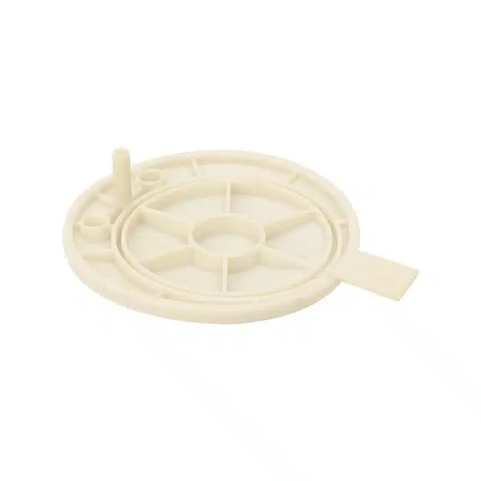 Round plastic spare part with central spoke design