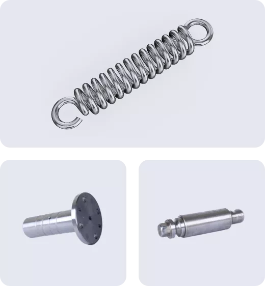 Metal spring and cylindrical components on white background.
