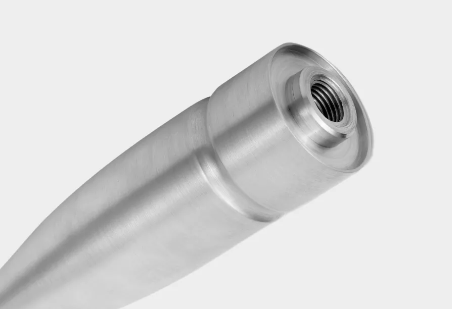 Close-up of metal cylindrical screw attachment.