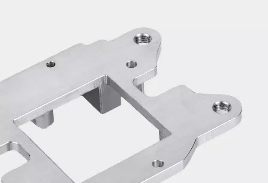 Metal bracket with screw holes.